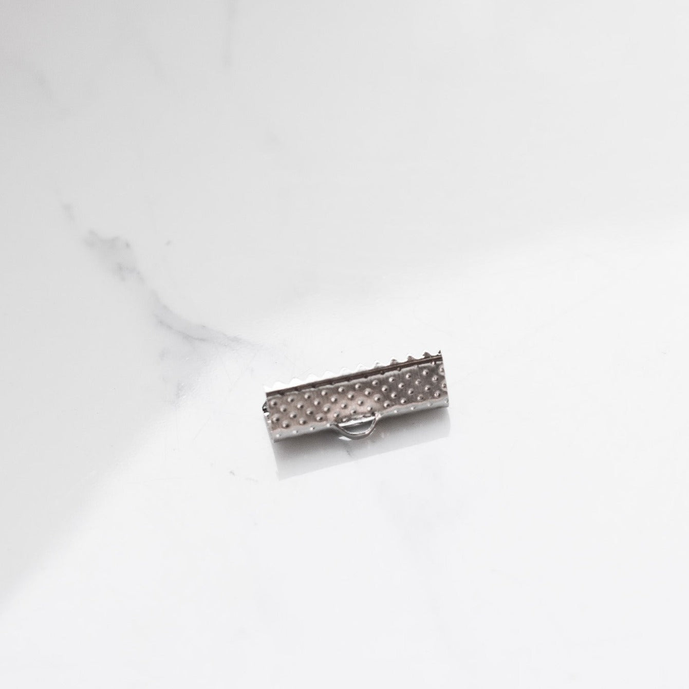 Alloy based buckle tips