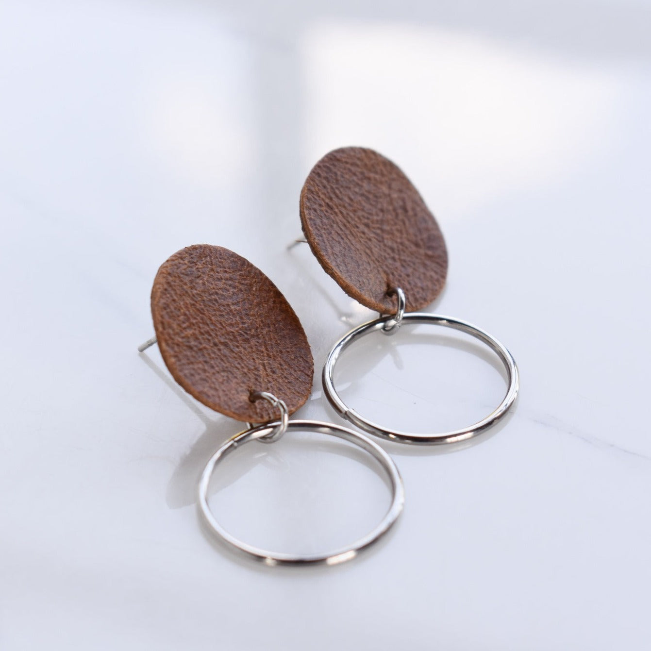 Handmade, light weight and comfortable to wear all day long leather earrings. All our earring hooks are made with a high quality stainless steel and they are hypo allergenic. They will not tarnish or irritate your sensitive skin.