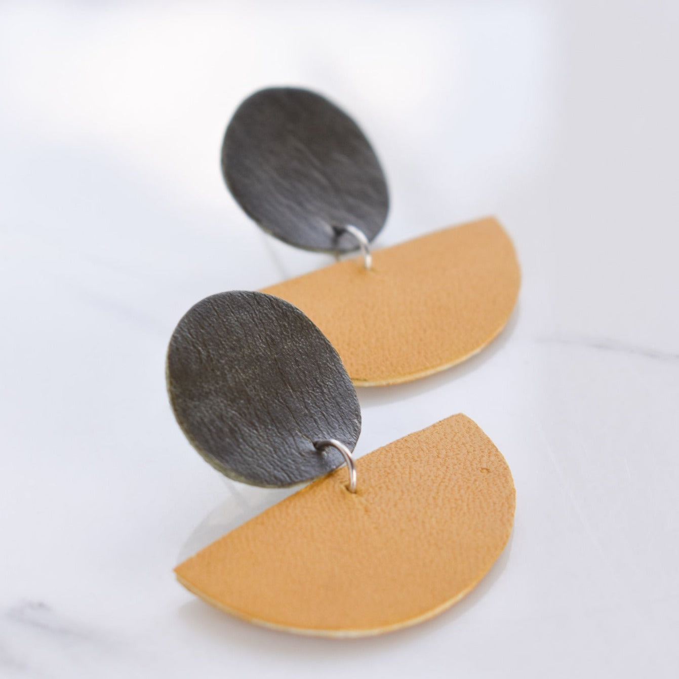 Handmade, light weight and comfortable to wear all day long leather earrings. All our earring hooks are made with a high quality stainless steel and they are hypo allergenic. They will not tarnish or irritate your sensitive skin.