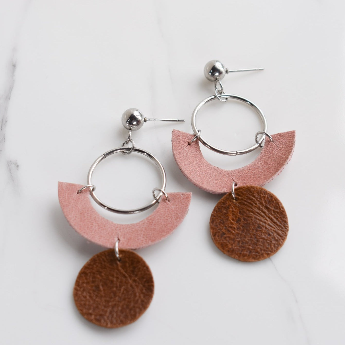 Handmade, light weight and comfortable to wear all day long leather earrings. All our earring hooks are made with a high quality stainless steel and they are hypo allergenic. They will not tarnish or irritate your sensitive skin.