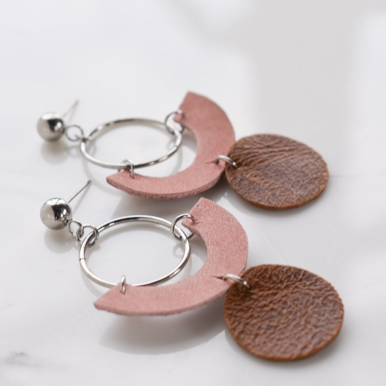 Handmade, light weight and comfortable to wear all day long leather earrings. All our earring hooks are made with a high quality stainless steel and they are hypo allergenic. They will not tarnish or irritate your sensitive skin.