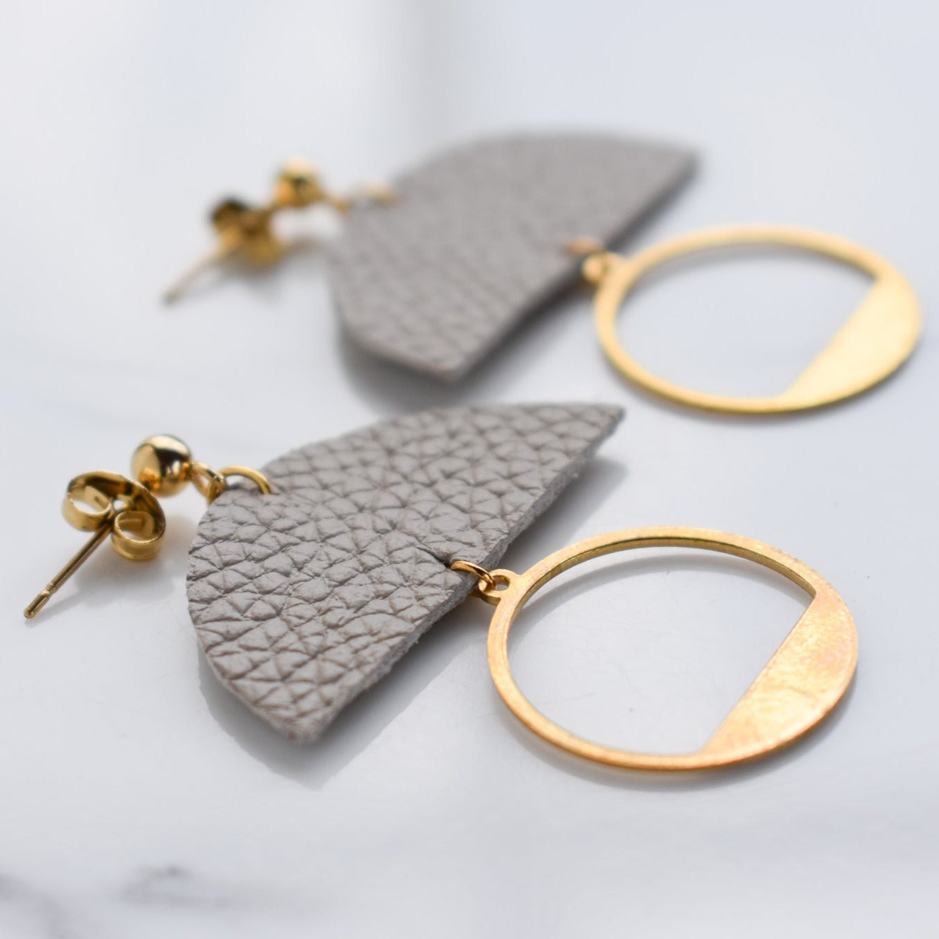 Handmade, light weight and comfortable to wear all day long leather earrings. All our earring hooks are made with a high quality stainless steel and they are hypo allergenic. They will not tarnish or irritate your sensitive skin.
