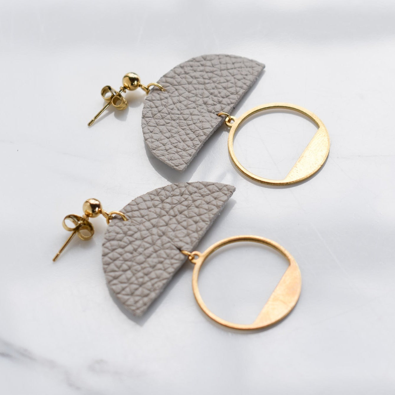 Handmade, light weight and comfortable to wear all day long leather earrings. All our earring hooks are made with a high quality stainless steel and they are hypo allergenic. They will not tarnish or irritate your sensitive skin.