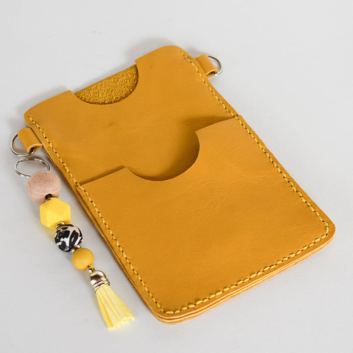 Beautifully handmade and hand stitched leather cellphone sling. Perfect for everyday use. It has a slot for cards and cash. Turn your sling towards your body for extra safety. This also makes an amazing gift and addition to a bridesmaids gift box. YOUR NEW BEST FRIEND - keep your belongings HANDS ON!