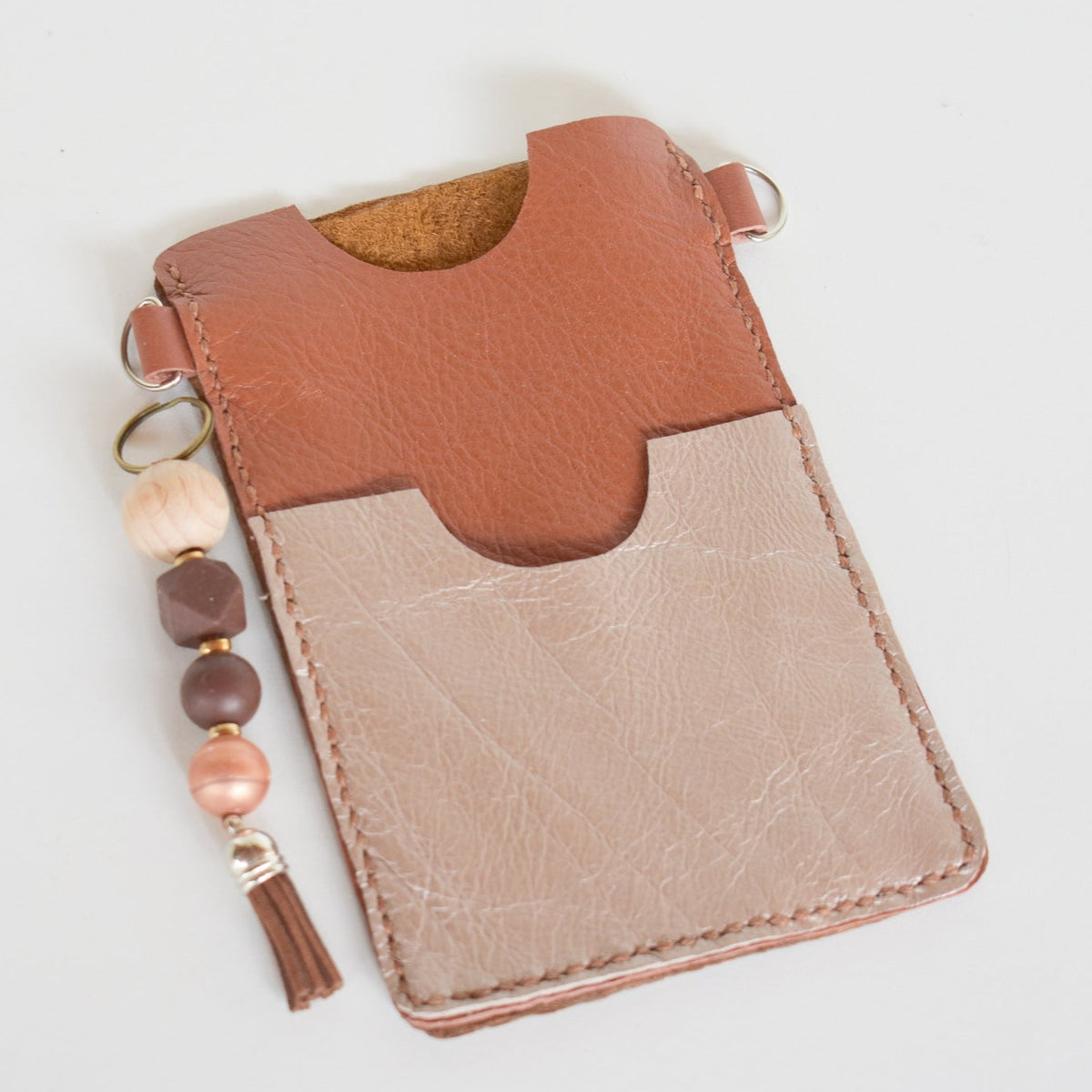 Beautifully handmade and hand stitched leather cellphone sling. Perfect for everyday use. It has a slot for cards and cash. Turn your sling towards your body for extra safety. This also makes an amazing gift and addition to a bridesmaids gift box. YOUR NEW BEST FRIEND - keep your belongings HANDS ON!