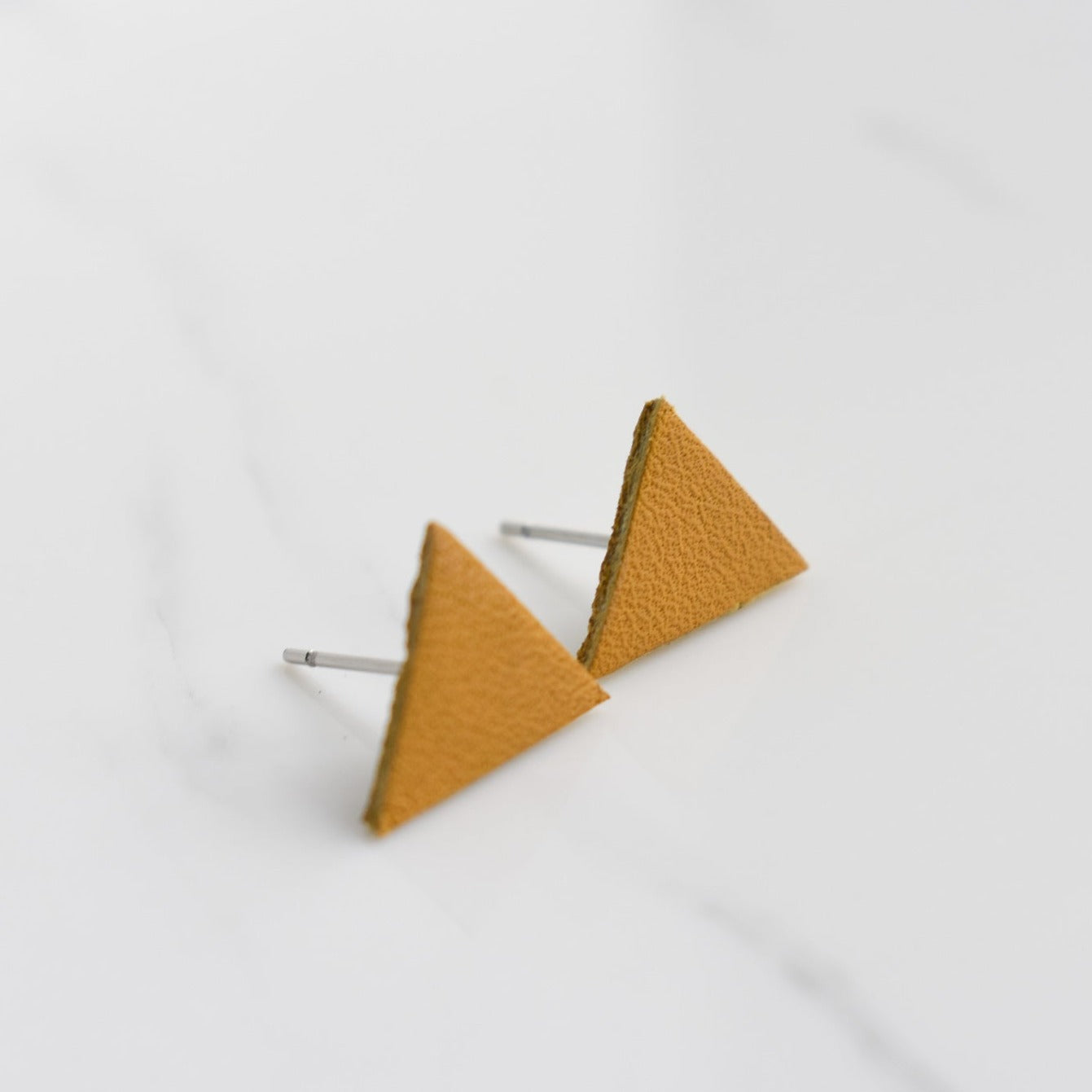 Handmade, light weight and comfortable to wear all day long leather earrings. All our earring hooks are made with a high quality stainless steel and they are hypo allergenic. They will not tarnish or irritate your sensitive skin.