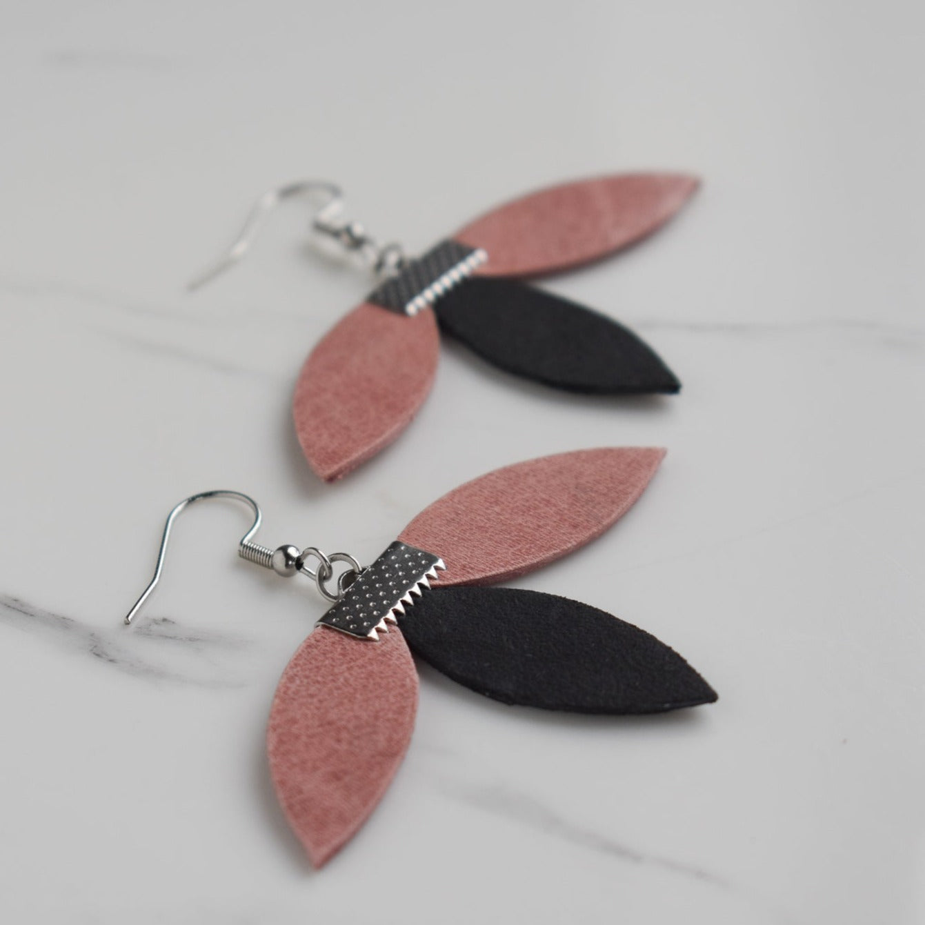 Handmade, light weight and comfortable to wear all day long leather earrings. All our earring hooks are made with a high quality stainless steel and they are hypo allergenic. They will not tarnish or irritate your sensitive skin.