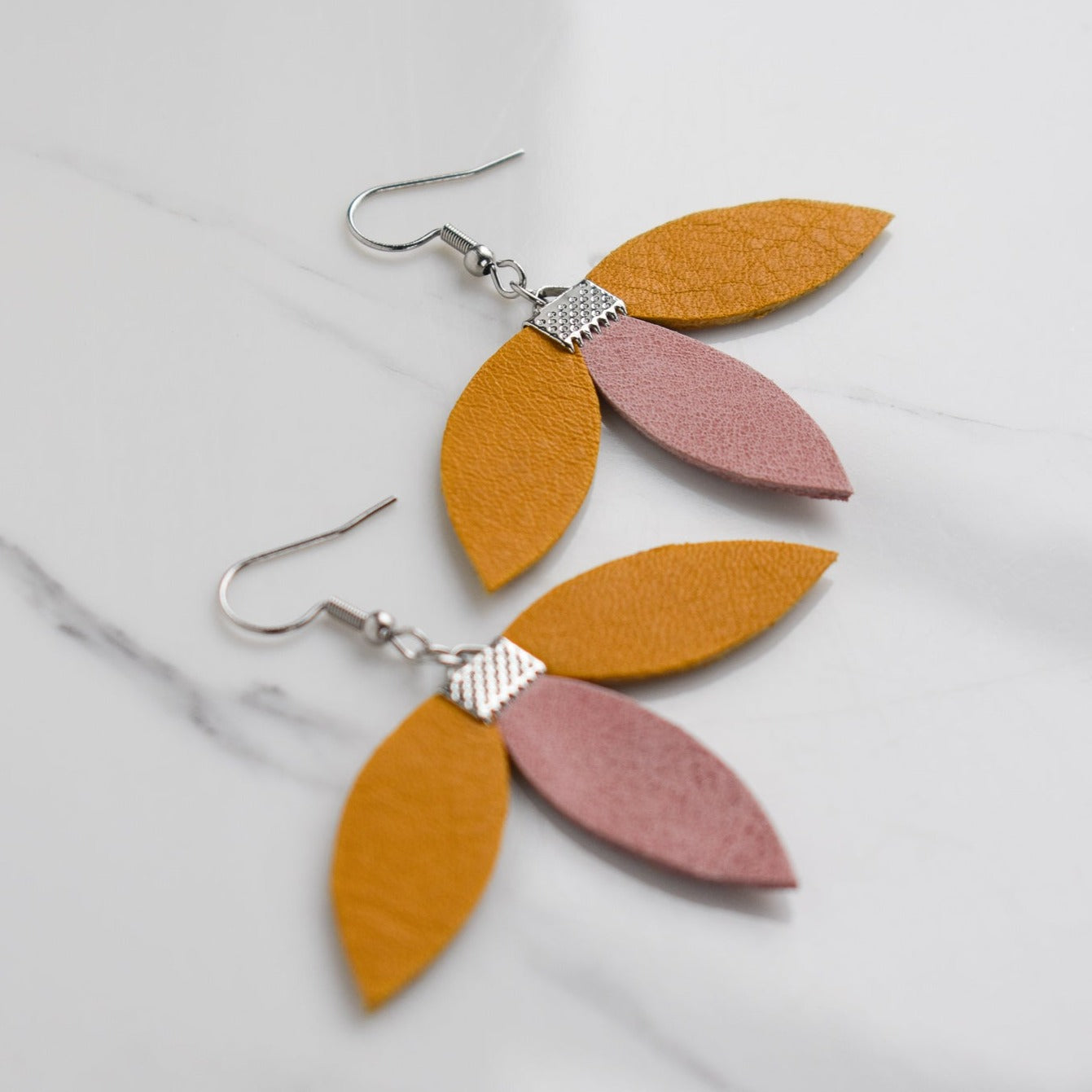 Handmade, light weight and comfortable to wear all day long leather earrings. All our earring hooks are made with a high quality stainless steel and they are hypo allergenic. They will not tarnish or irritate your sensitive skin.