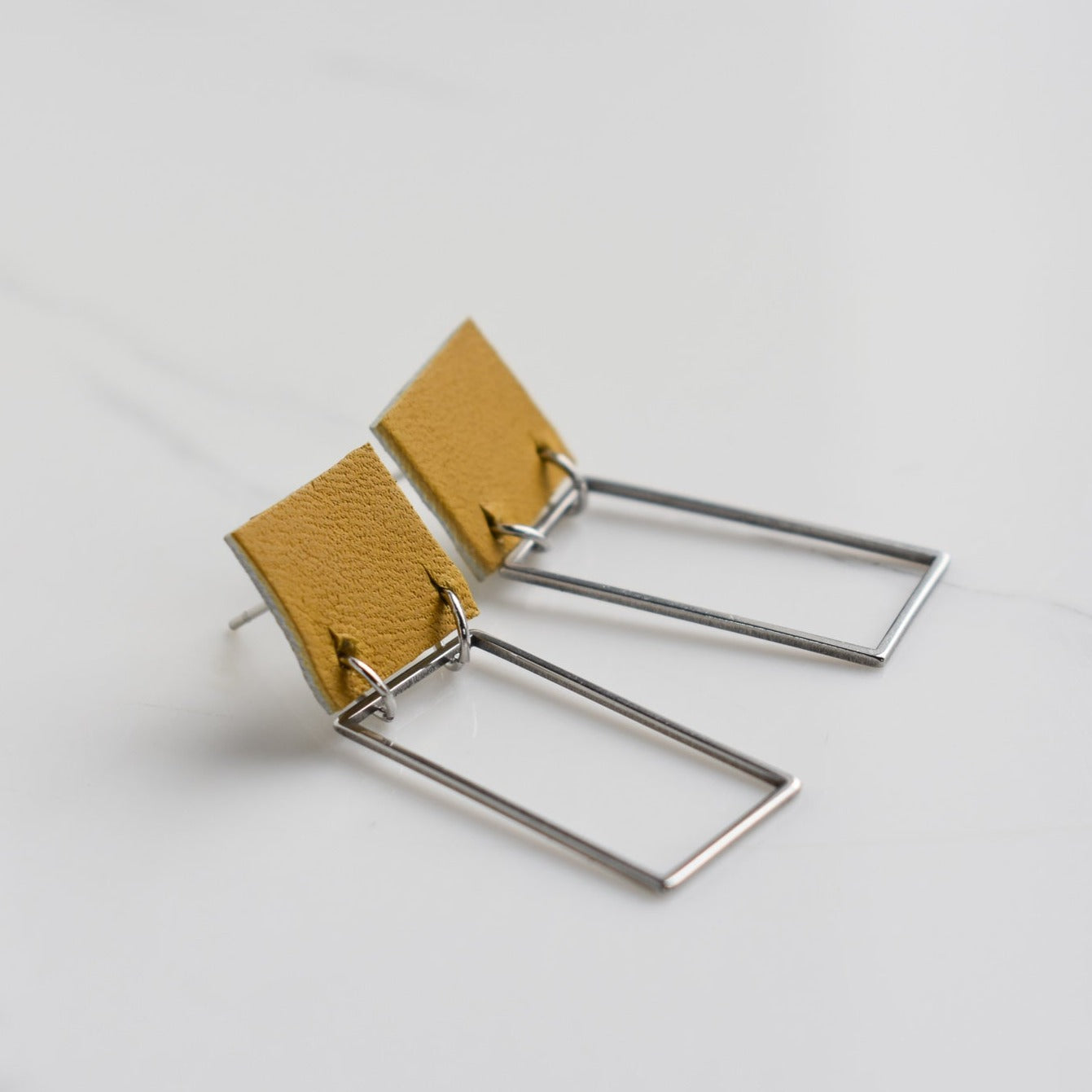 Handmade, light weight and comfortable to wear all day long leather earrings. All our earring hooks are made with a high quality stainless steel and they are hypo allergenic. They will not tarnish or irritate your sensitive skin.