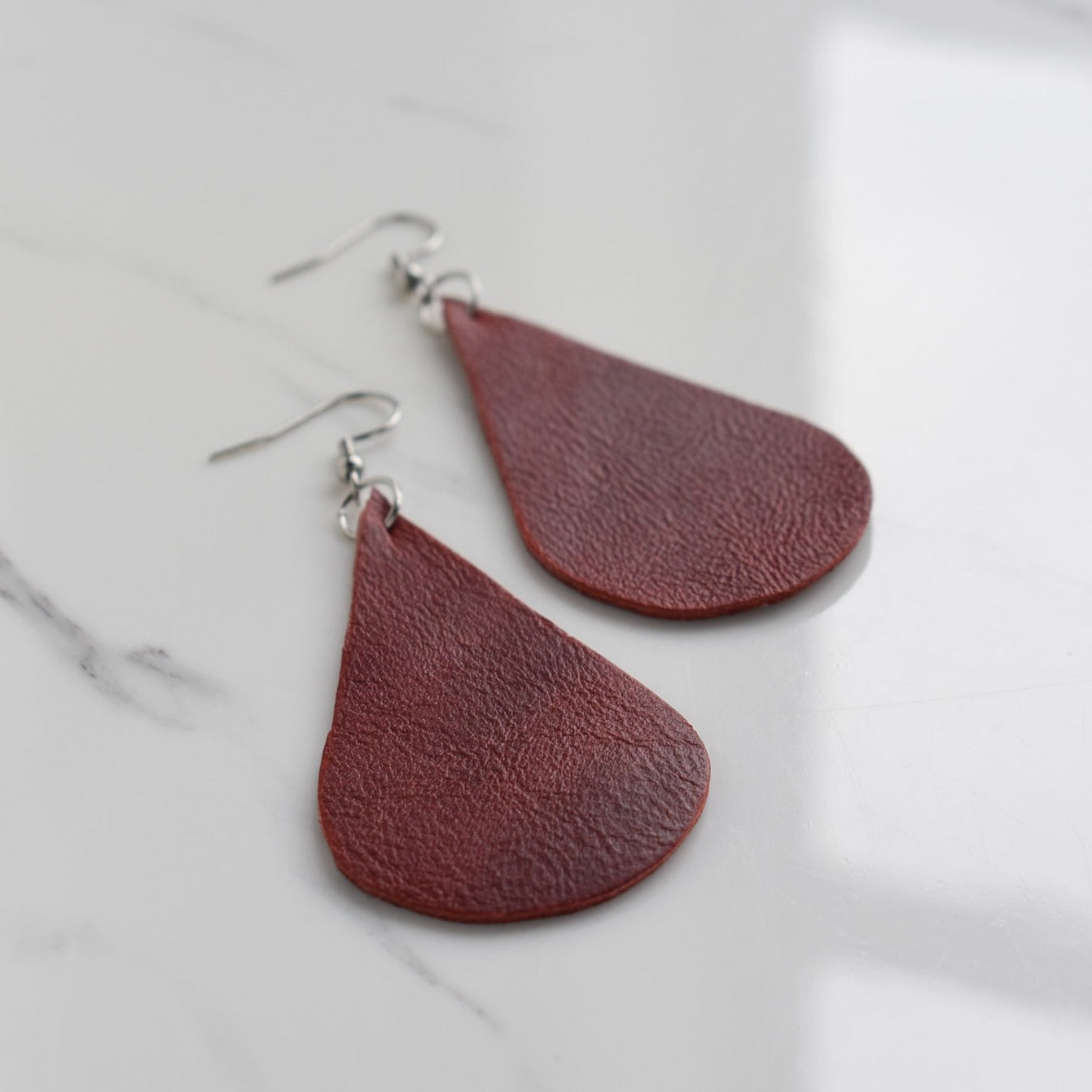 Handmade, light weight and comfortable to wear all day long leather earrings. All our earring hooks are made with a high quality stainless steel and they are hypo allergenic. They will not tarnish or irritate your sensitive skin.