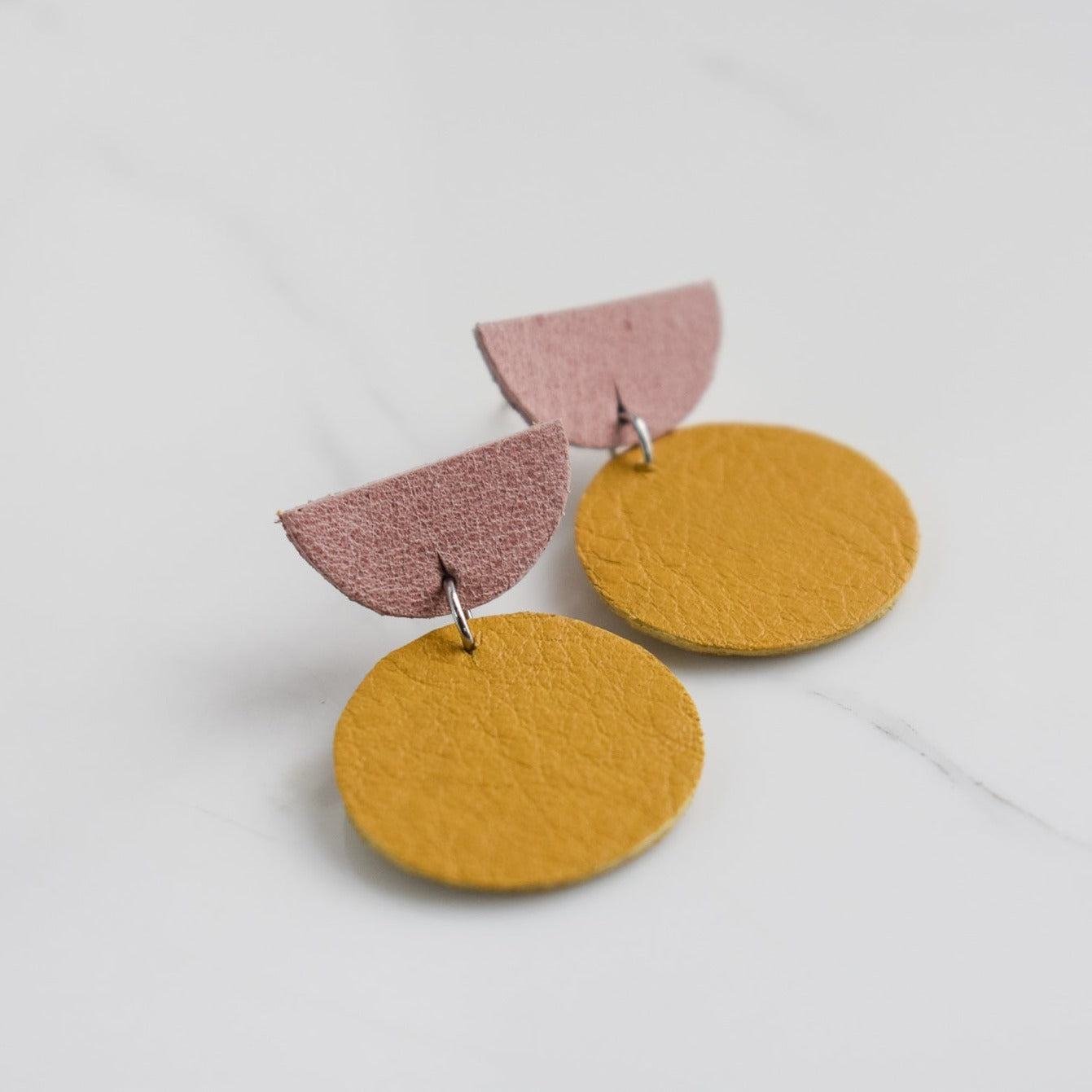 Handmade, light weight and comfortable to wear all day long leather earrings. All our earring hooks are made with a high quality stainless steel and they are hypo allergenic. They will not tarnish or irritate your sensitive skin.