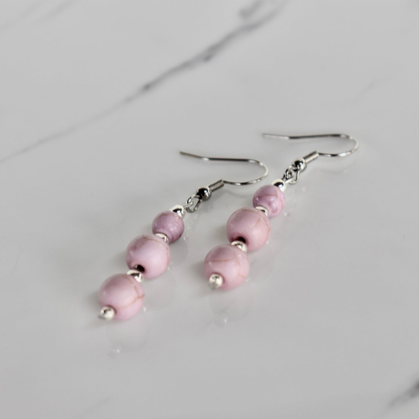 Handmade, light weight and comfortable to wear all day long earrings with beads. Available in silver. All our earring hooks are made with a high quality stainless steel and they are hypo allergenic. They will not tarnish or irritate your sensitive skin.