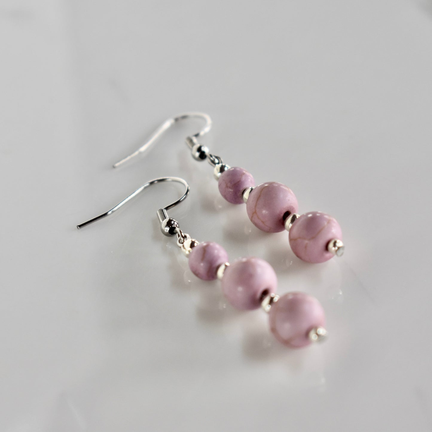 Handmade, light weight and comfortable to wear all day long earrings with beads. Available in silver. All our earring hooks are made with a high quality stainless steel and they are hypo allergenic. They will not tarnish or irritate your sensitive skin.