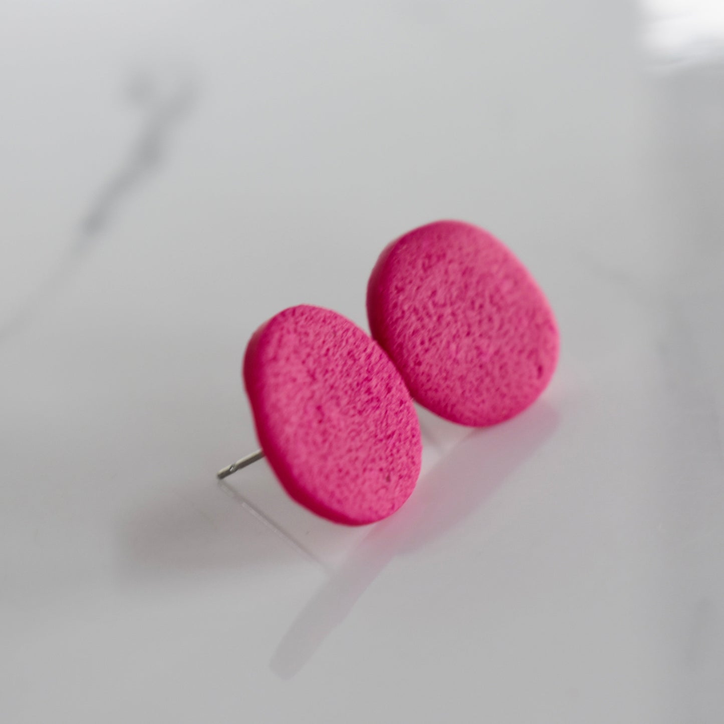 Handmade, light weight and comfortable to wear all day long clay studs earrings. Available in silver or gold. All our earring hooks are made with a high quality stainless steel and they are hypo allergenic. They will not tarnish or irritate your sensitive skin.
