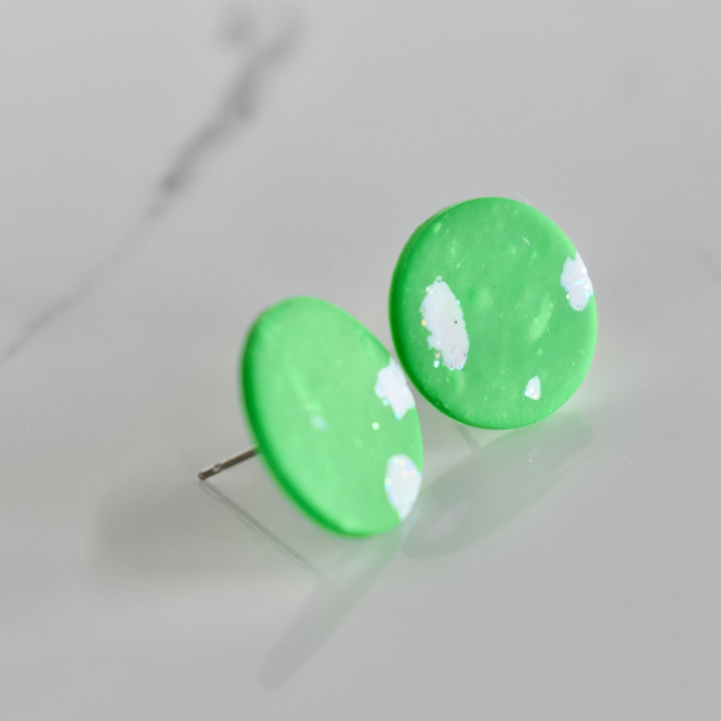 Handmade, light weight and comfortable to wear all day long clay studs earrings. Available in silver or gold. All our earring hooks are made with a high quality stainless steel and they are hypo allergenic. They will not tarnish or irritate your sensitive skin.