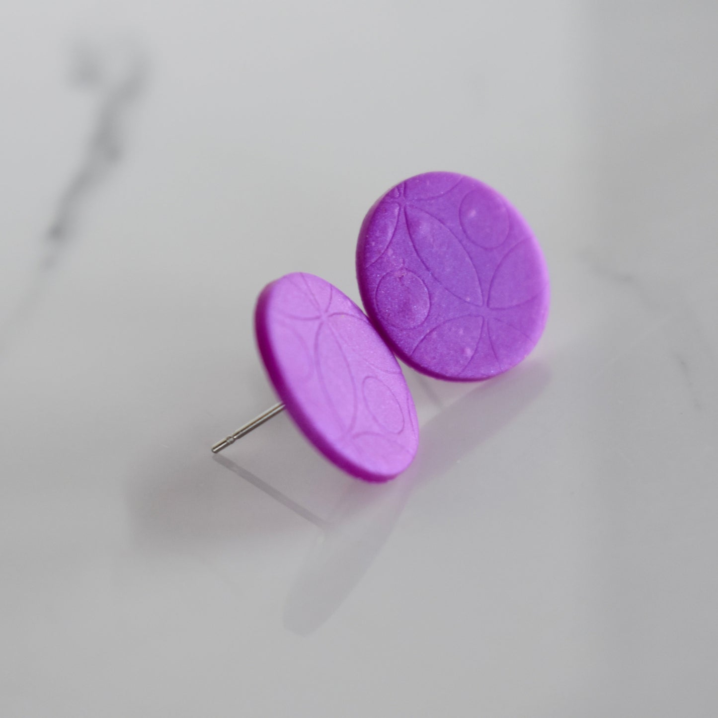 Handmade, light weight and comfortable to wear all day long clay studs earrings. Available in silver or gold. All our earring hooks are made with a high quality stainless steel and they are hypo allergenic. They will not tarnish or irritate your sensitive skin.
