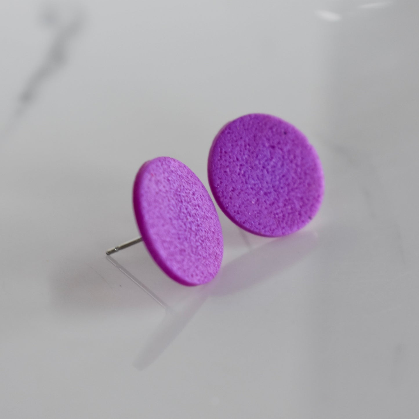 Handmade, light weight and comfortable to wear all day long clay studs earrings. Available in silver or gold. All our earring hooks are made with a high quality stainless steel and they are hypo allergenic. They will not tarnish or irritate your sensitive skin.