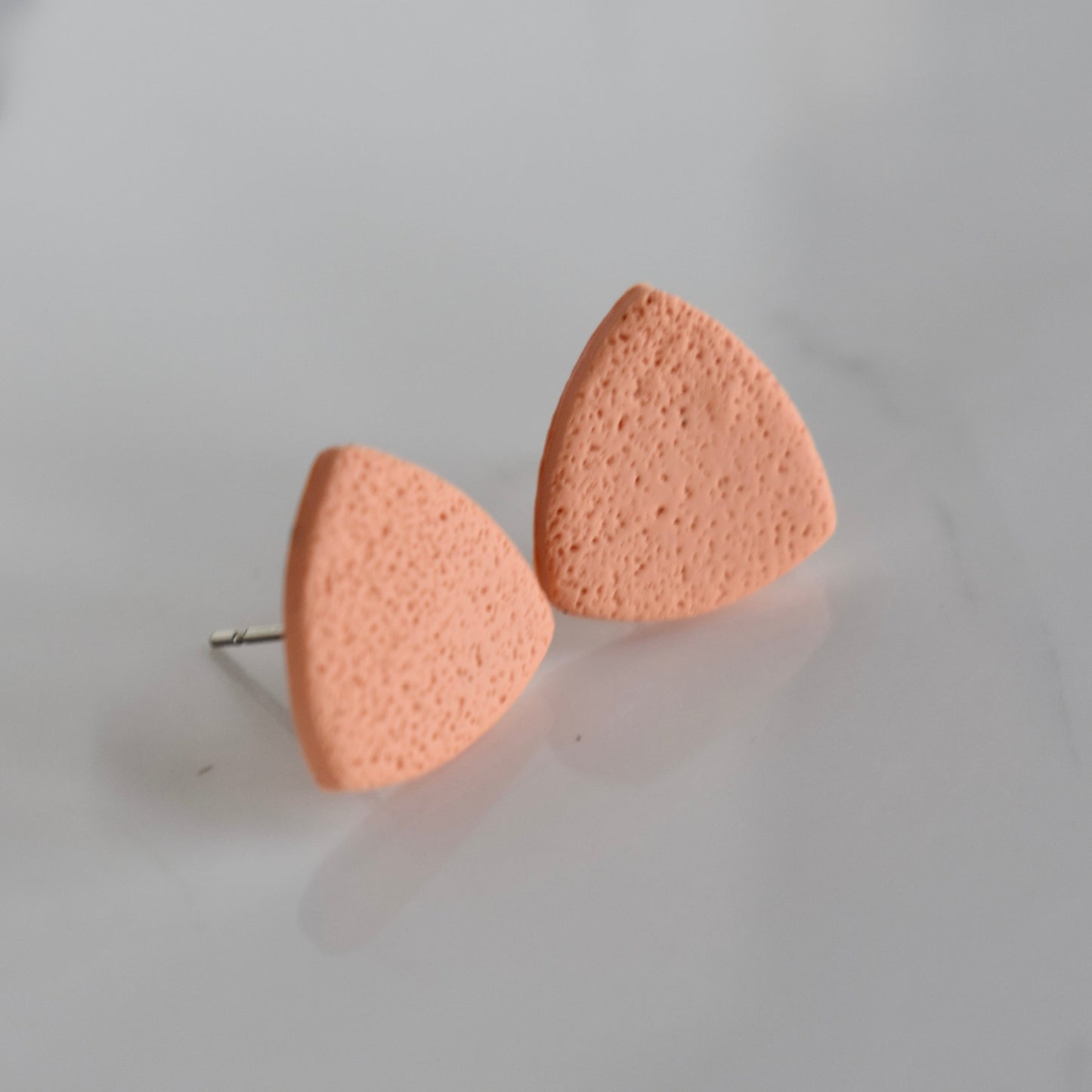 Handmade, light weight and comfortable to wear all day long clay studs earrings. Available in silver or gold. All our earring hooks are made with a high quality stainless steel and they are hypo allergenic. They will not tarnish or irritate your sensitive skin.