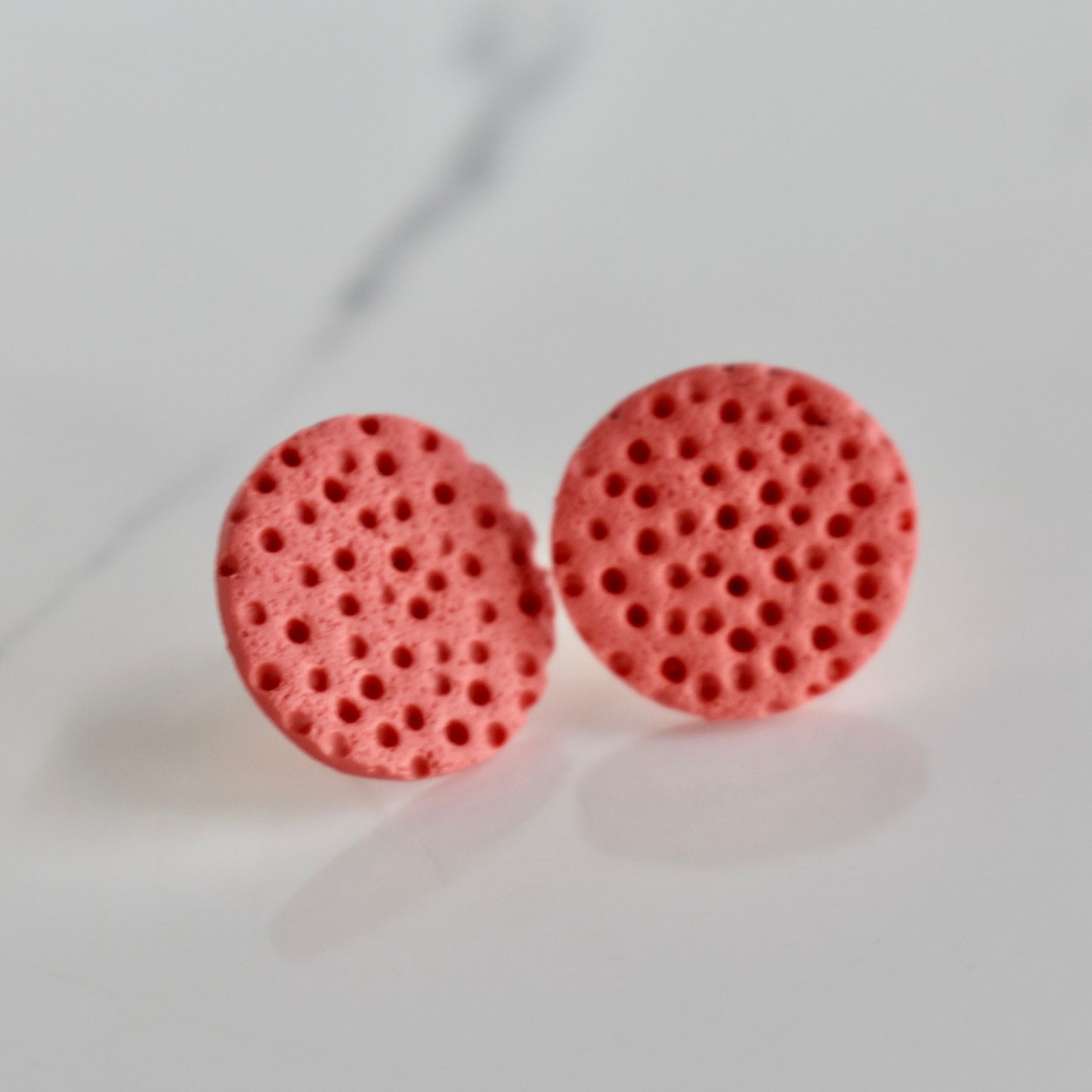 Handmade, light weight and comfortable to wear all day long clay studs earrings. Available in silver or gold. All our earring hooks are made with a high quality stainless steel and they are hypo allergenic. They will not tarnish or irritate your sensitive skin.
