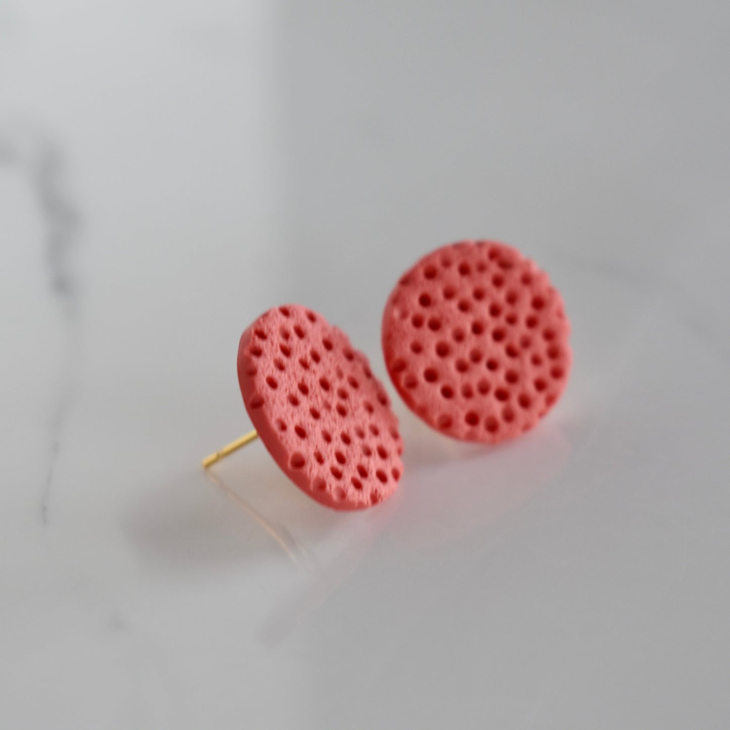 Handmade, light weight and comfortable to wear all day long clay studs earrings. Available in silver or gold. All our earring hooks are made with a high quality stainless steel and they are hypo allergenic. They will not tarnish or irritate your sensitive skin.