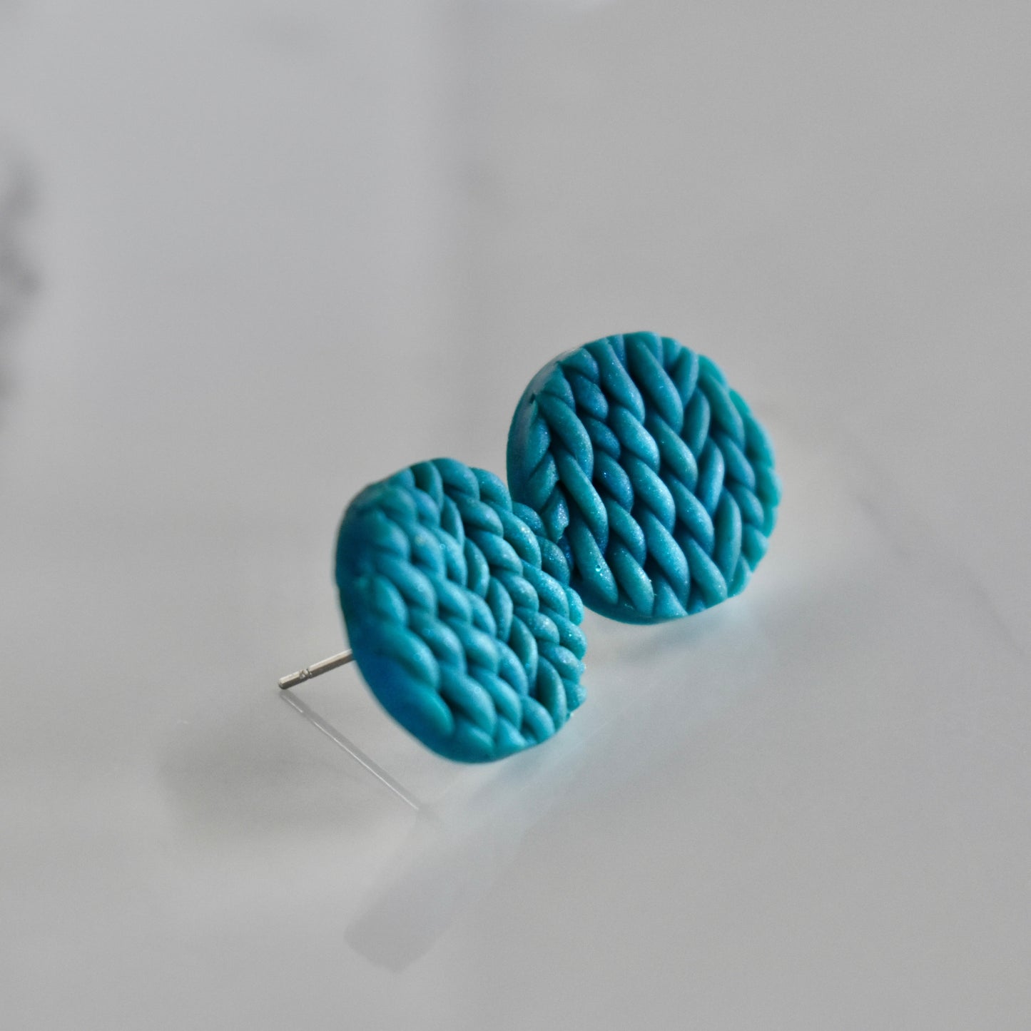 Handmade, light weight and comfortable to wear all day long clay studs earrings. Available in silver or gold. All our earring hooks are made with a high quality stainless steel and they are hypo allergenic. They will not tarnish or irritate your sensitive skin.