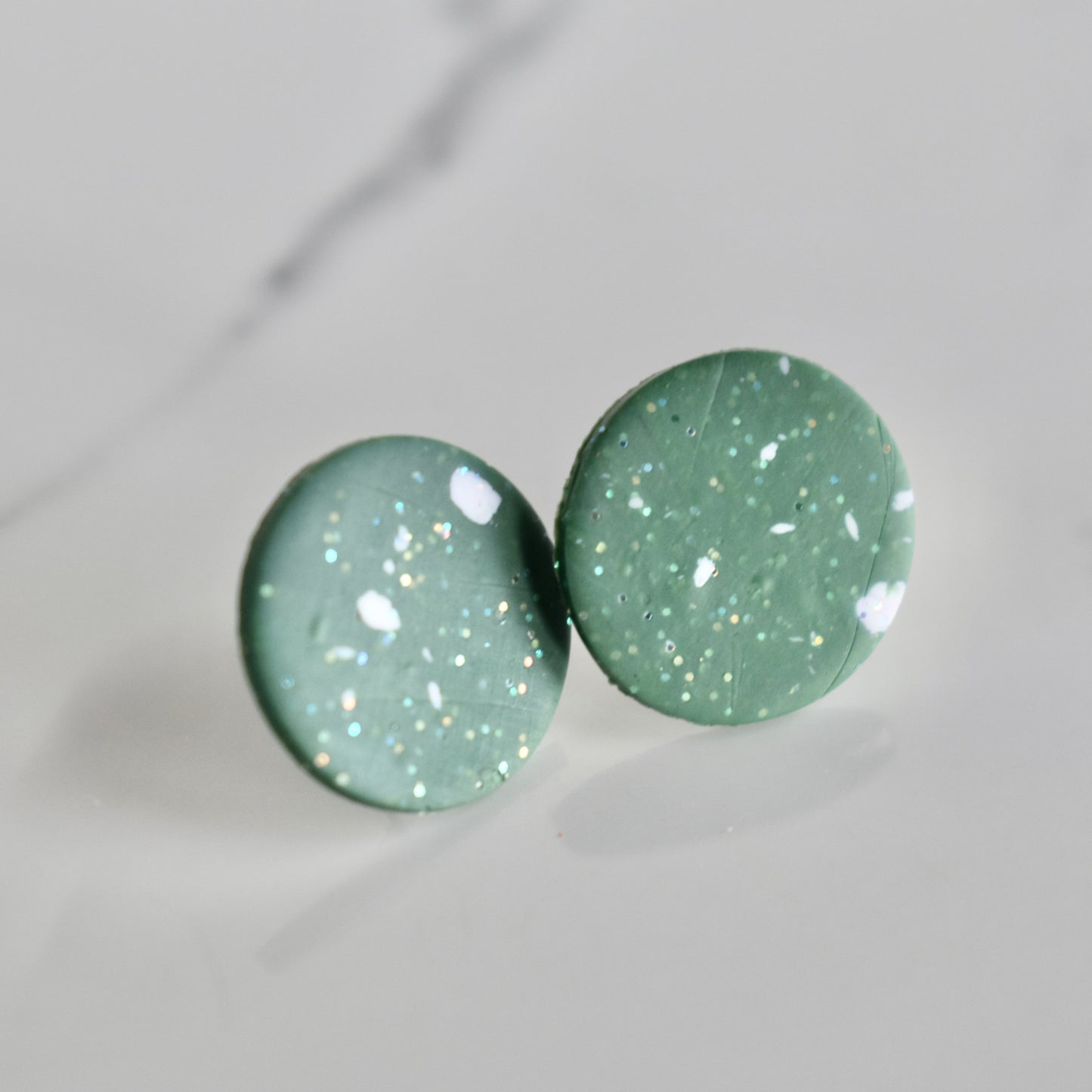 Handmade, light weight and comfortable to wear all day long clay studs earrings. Available in silver or gold. All our earring hooks are made with a high quality stainless steel and they are hypo allergenic. They will not tarnish or irritate your sensitive skin.