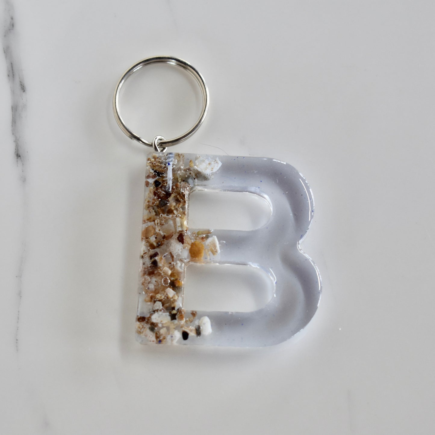 Beautifully hand made resin keychain. A perfect addition to a gift or a great thank you gift for a wedding.