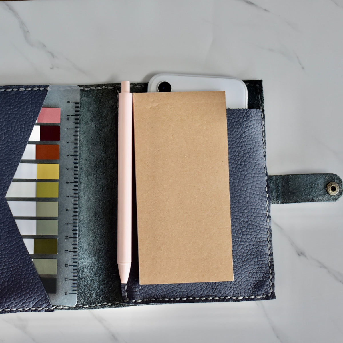 Beautifully handmade and hand stitched leather notebook. Perfect for a gift idea. This also makes an amazing addition to a bridesmaids gift box. This item includes a pen, small notebook as well as some aesthetic sticky notes! The best part is it will fit your phone as well.