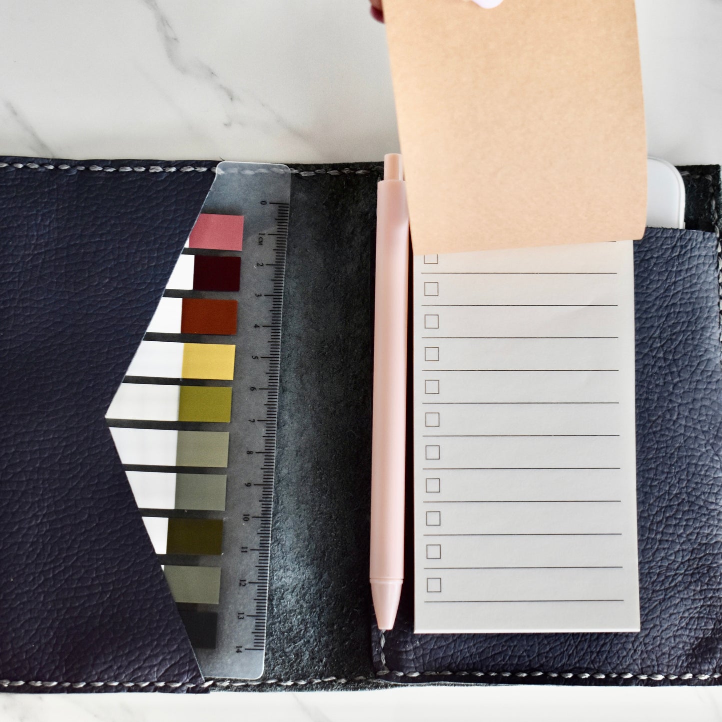 Beautifully handmade and hand stitched leather notebook. Perfect for a gift idea. This also makes an amazing addition to a bridesmaids gift box. This item includes a pen, small notebook as well as some aesthetic sticky notes! The best part is it will fit your phone as well.