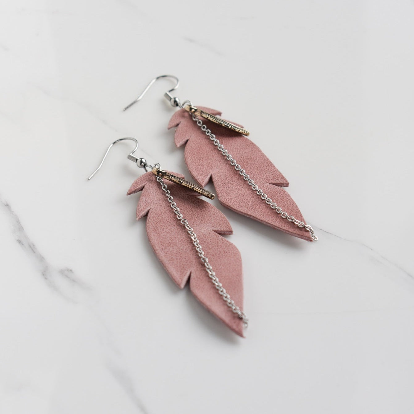 Handmade, light weight and comfortable to wear all day long leather earrings. All our earring hooks are made with a high quality stainless steel and they are hypo allergenic. They will not tarnish or irritate your sensitive skin.