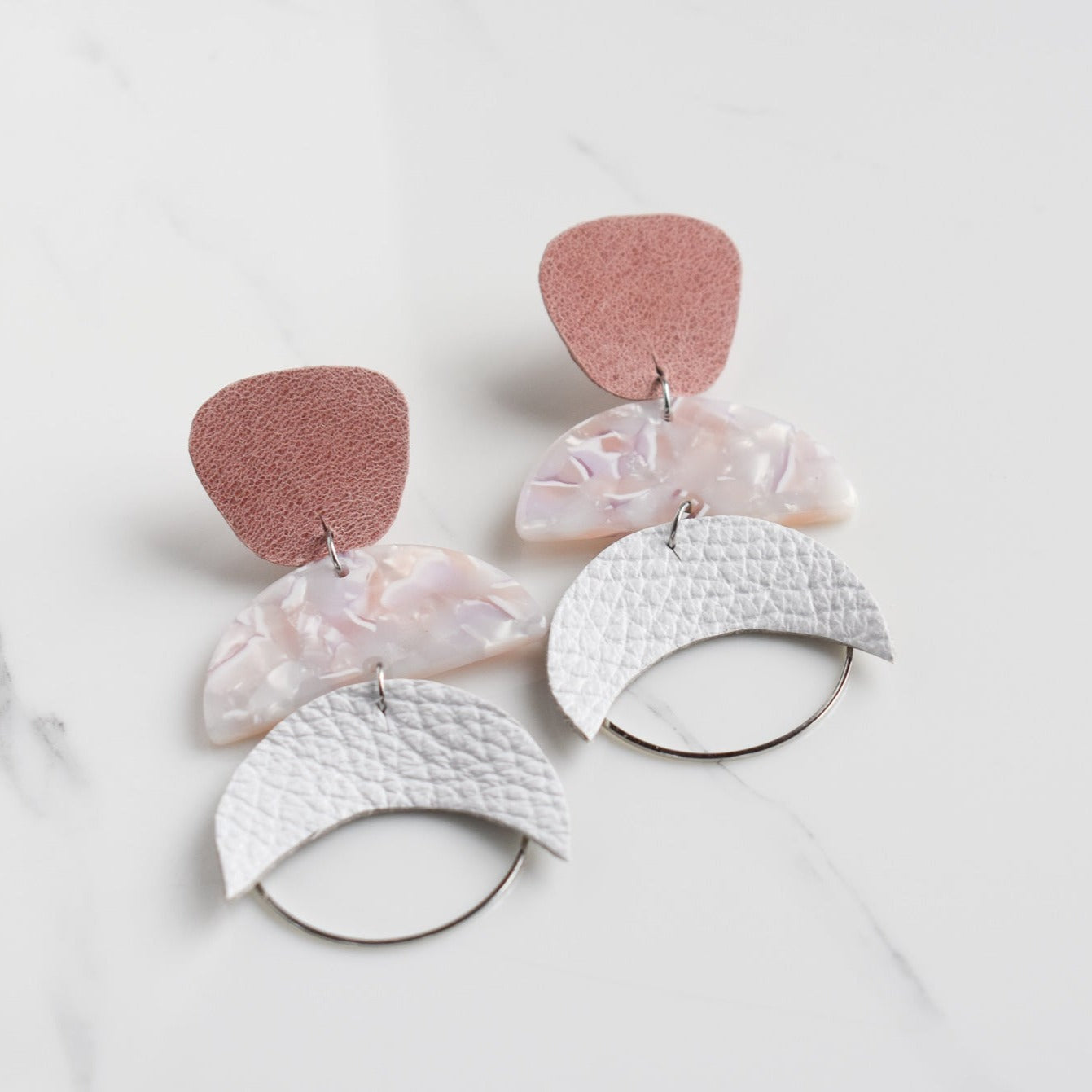 Handmade, light weight and comfortable to wear all day long leather earrings. All our earring hooks are made with a high quality stainless steel and they are hypo allergenic. They will not tarnish or irritate your sensitive skin.