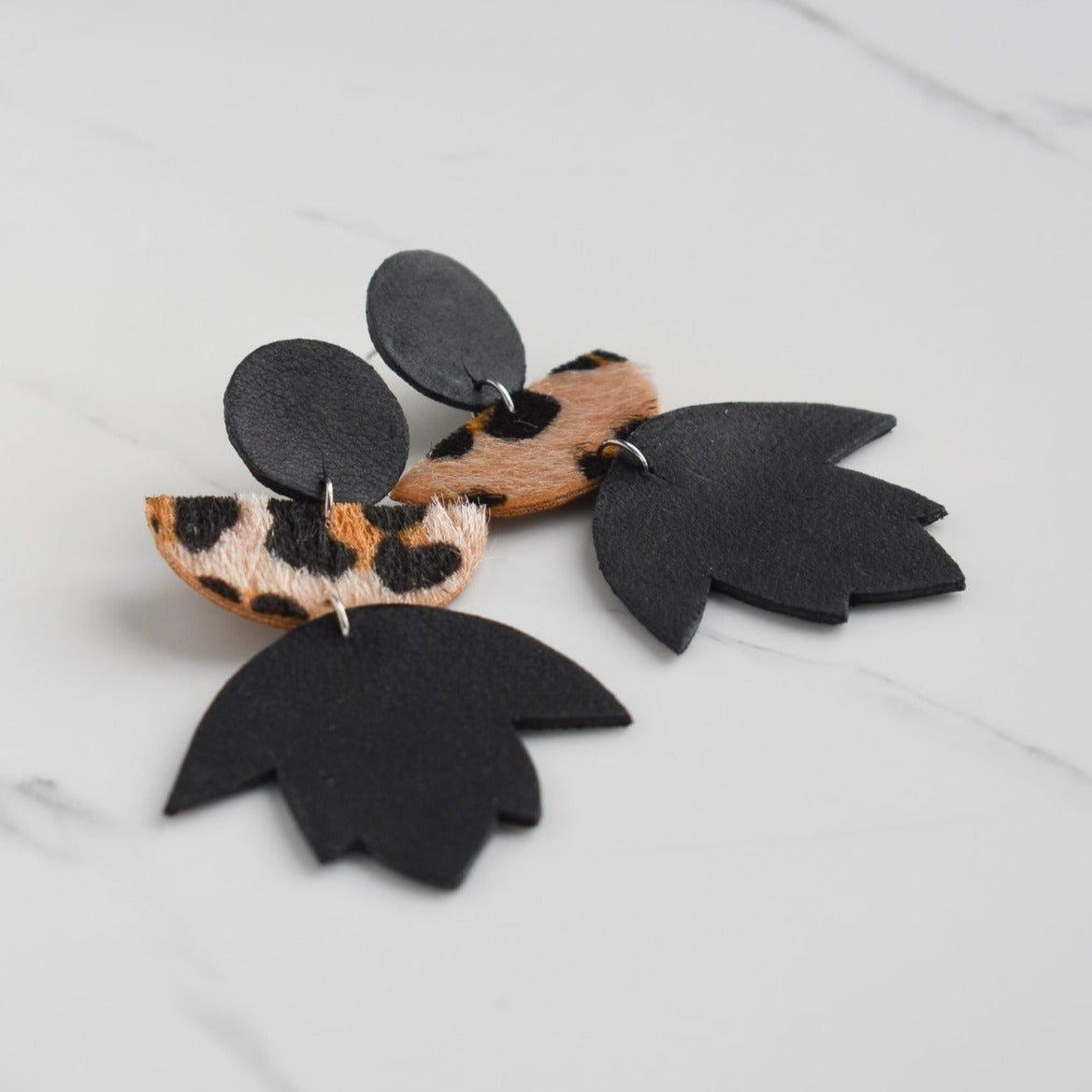 Handmade, light weight and comfortable to wear all day long leather earrings. All our earring hooks are made with a high quality stainless steel and they are hypo allergenic. They will not tarnish or irritate your sensitive skin.