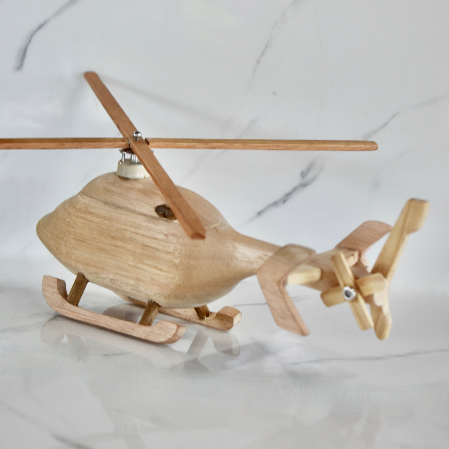 This small handmade wooden helicopter is the perfect present for any kid (or kid at heart)! It can be left as is or painted for an extra touch of fun. Makes for an amazing baby shower gift.
