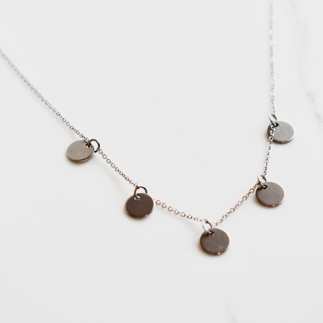 Beautifully handcrafted 5 disc rose gold stainless steel necklace. Waterproof and hypoallergenic.