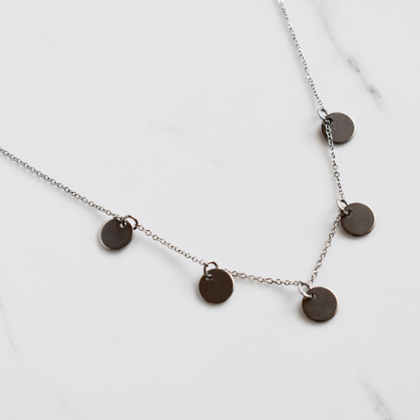 Beautifully handcrafted 5 disc rose gold stainless steel necklace. Waterproof and hypoallergenic.