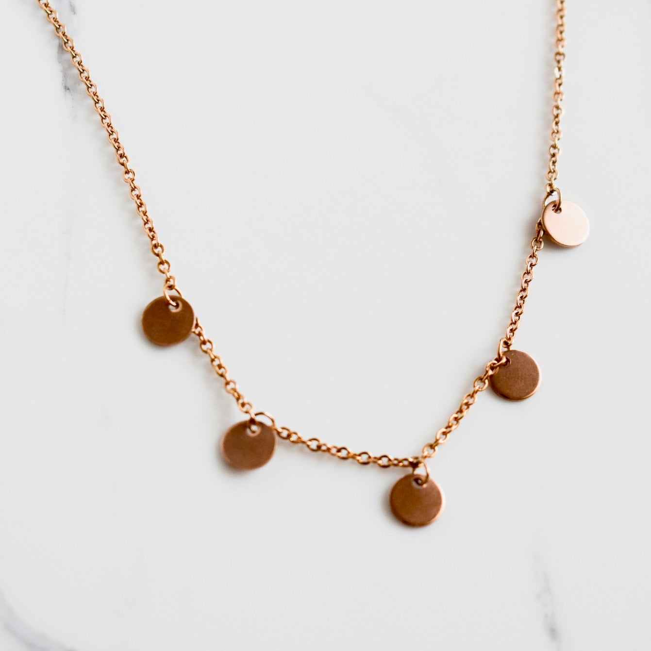 Beautifully handcrafted 5 disc rose gold stainless steel necklace. Waterproof and hypoallergenic.