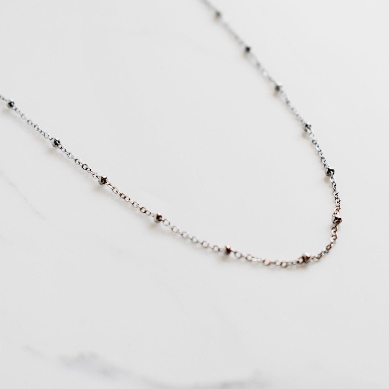 Beautifully handcrafted 5 disc rose gold stainless steel necklace. Waterproof and hypoallergenic.