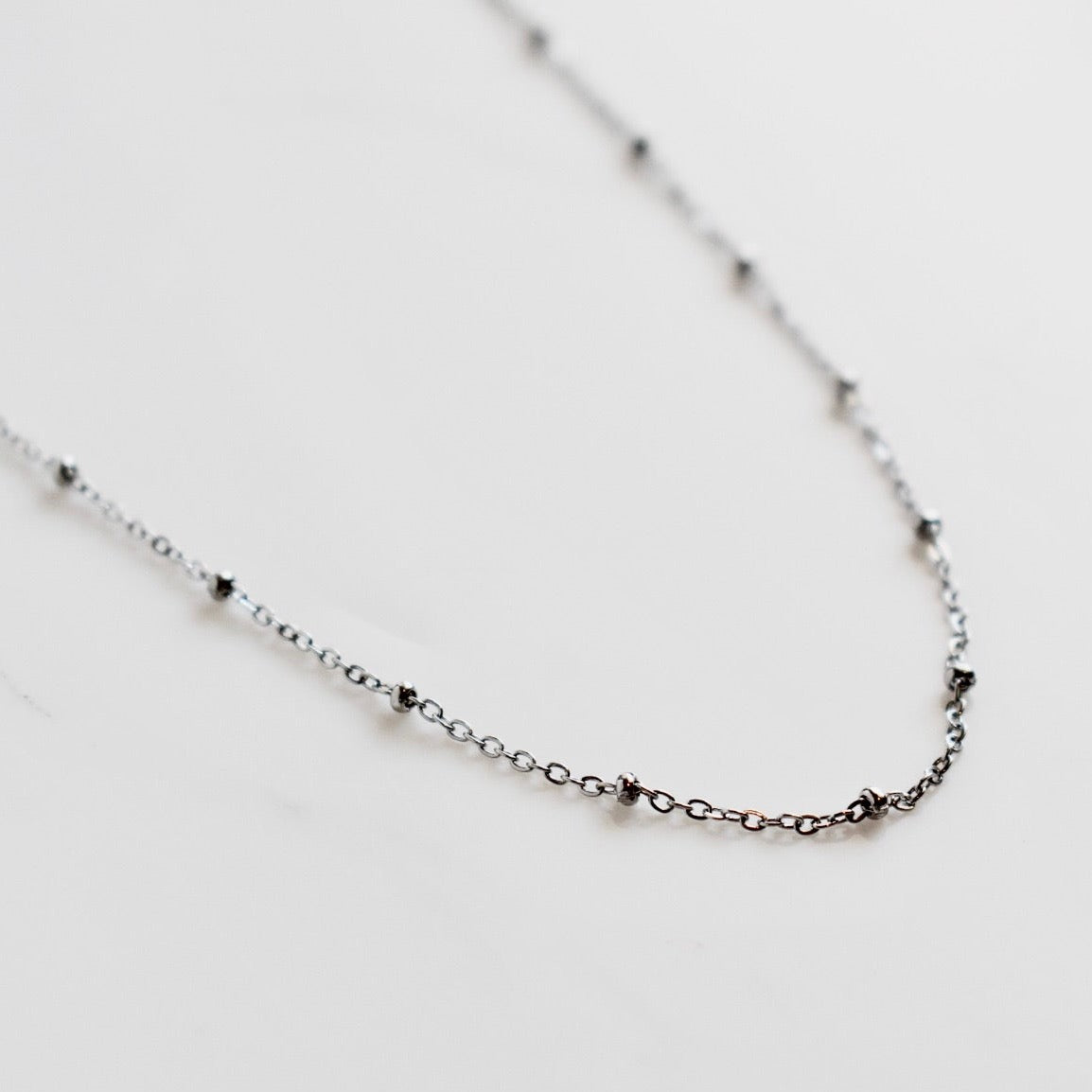 Beautifully handcrafted 5 disc rose gold stainless steel necklace. Waterproof and hypoallergenic.