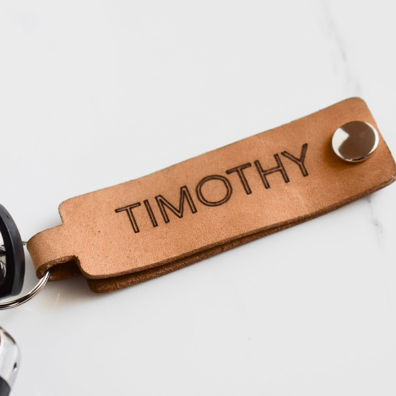 Beautifully hand made leather keychain. A perfect addition to a gift or a great thank you gift for a wedding. Price includes 1x engraved name.