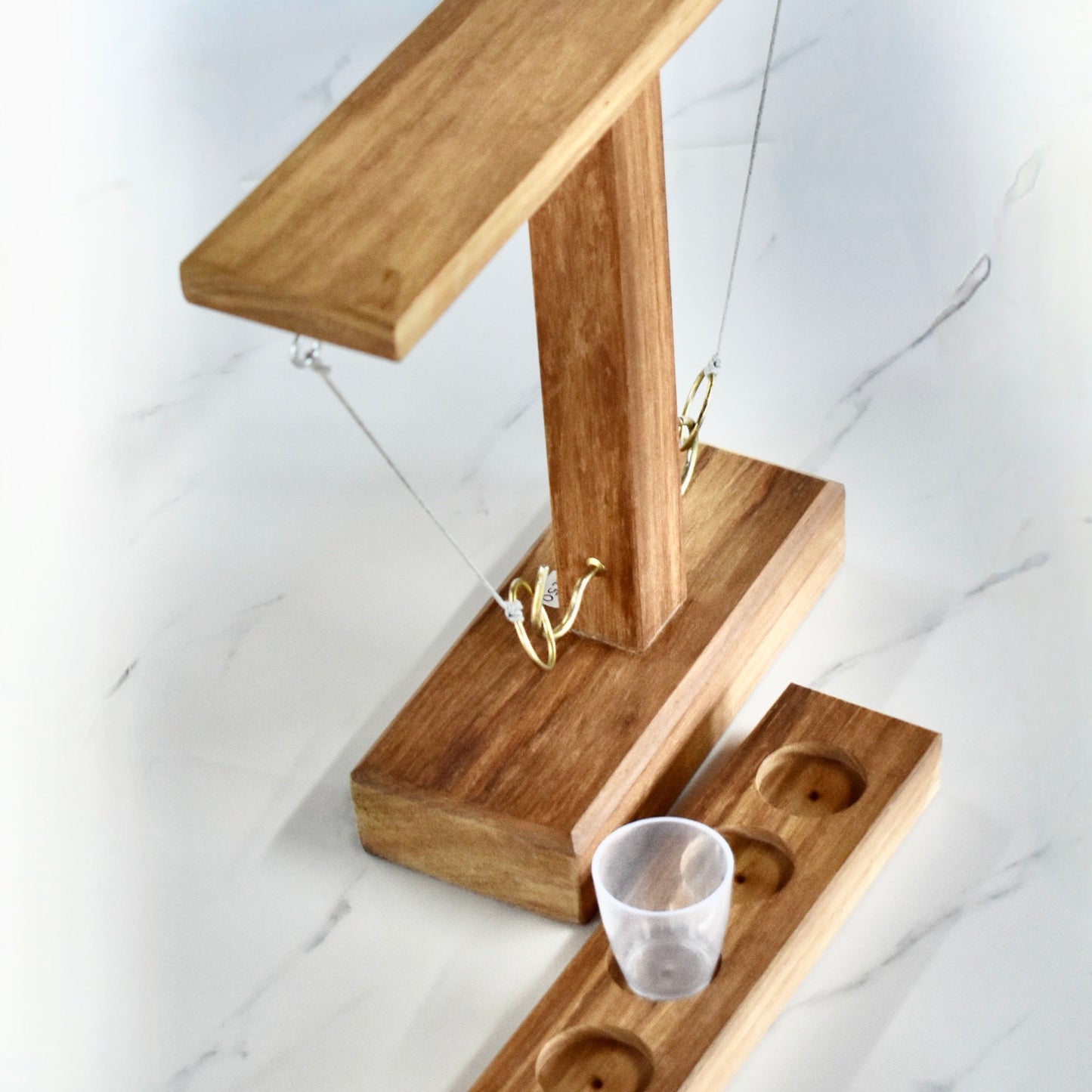 Crafted from sturdy Kiaat wood, this unique drinking game guarantees hours of endless entertainment. It's the ultimate gift for your significant other, dad, or buddy. Impress your braai companions and up your host game with this whimsical and playful addition.