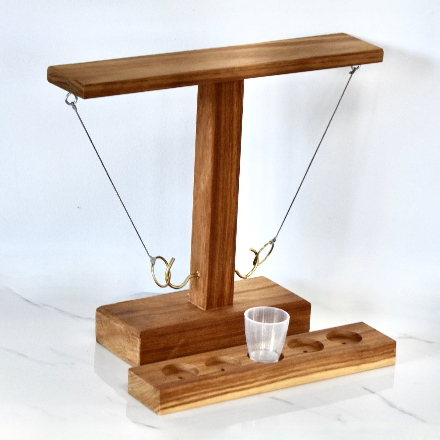 Crafted from sturdy Kiaat wood, this unique drinking game guarantees hours of endless entertainment. It's the ultimate gift for your significant other, dad, or buddy. Impress your braai companions and up your host game with this whimsical and playful addition.