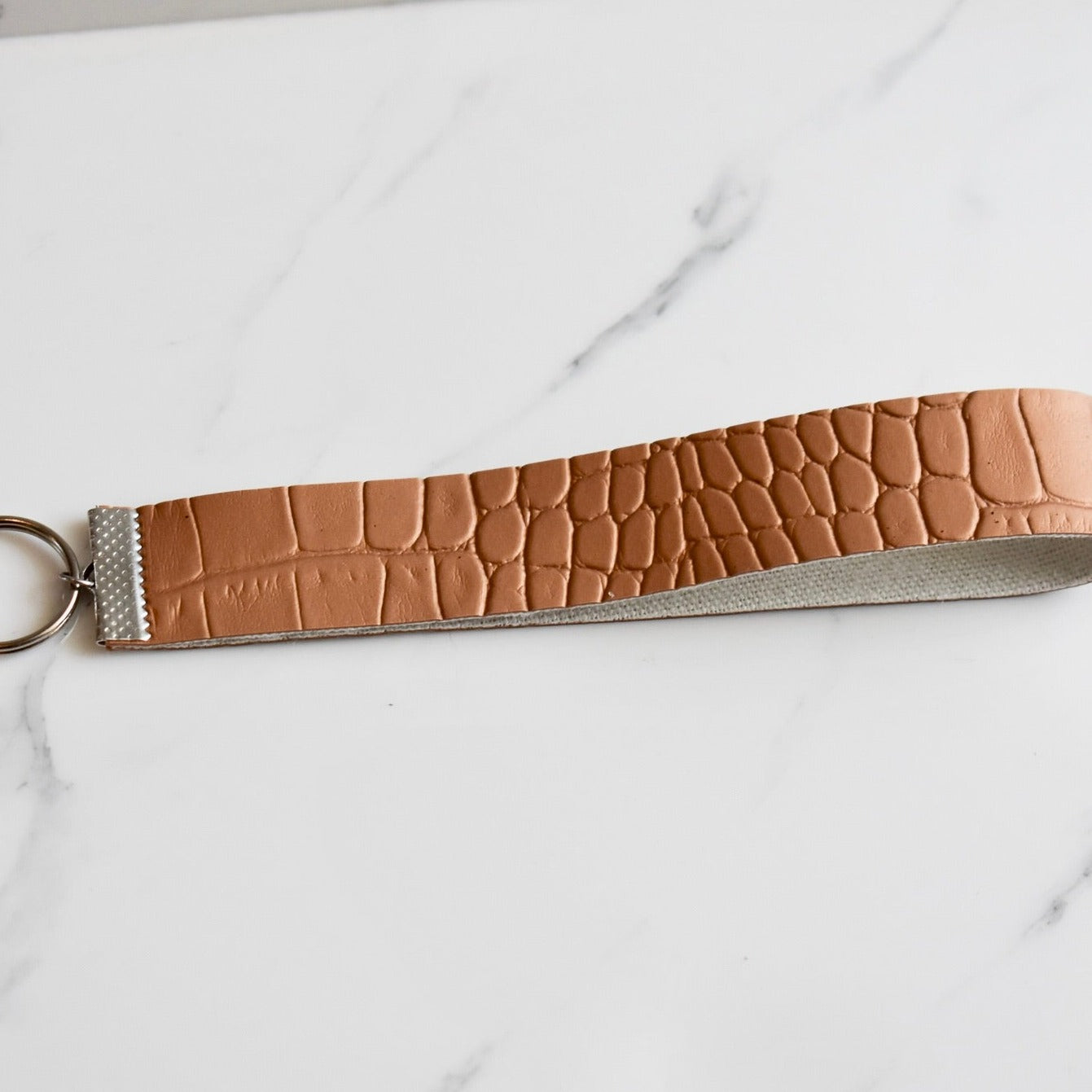 Beautifully hand made faux leather keychain. A perfect addition to a gift or a great thank you gift for a wedding.
