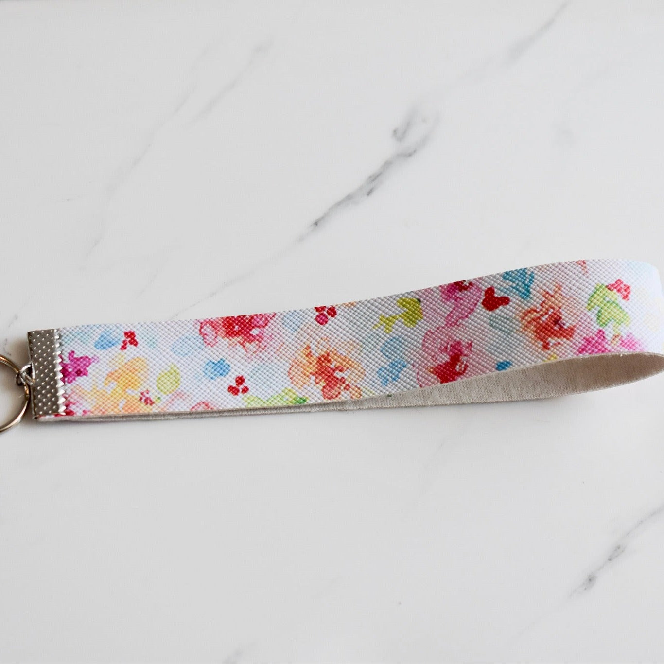 Beautifully hand made faux leather keychain. A perfect addition to a gift or a great thank you gift for a wedding.