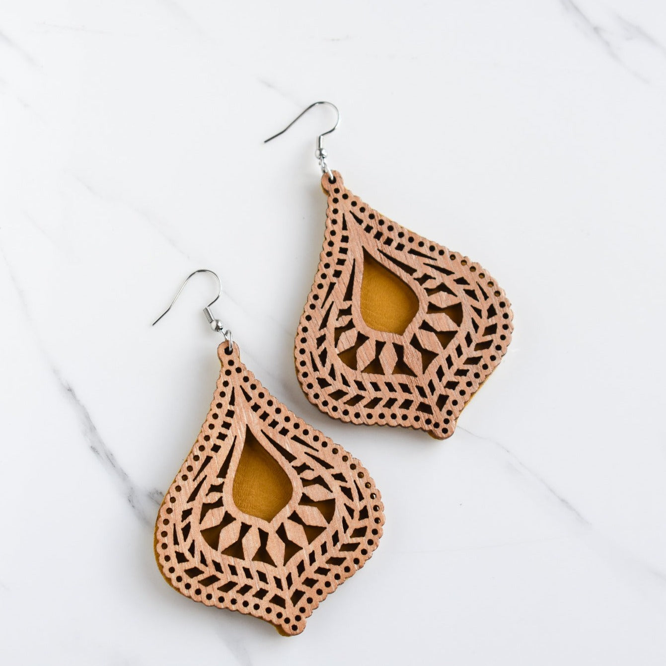 Handmade, light weight and comfortable to wear all day long leather earrings. All our earring hooks are made with a high quality stainless steel and they are hypo allergenic. They will not tarnish or irritate your sensitive skin.