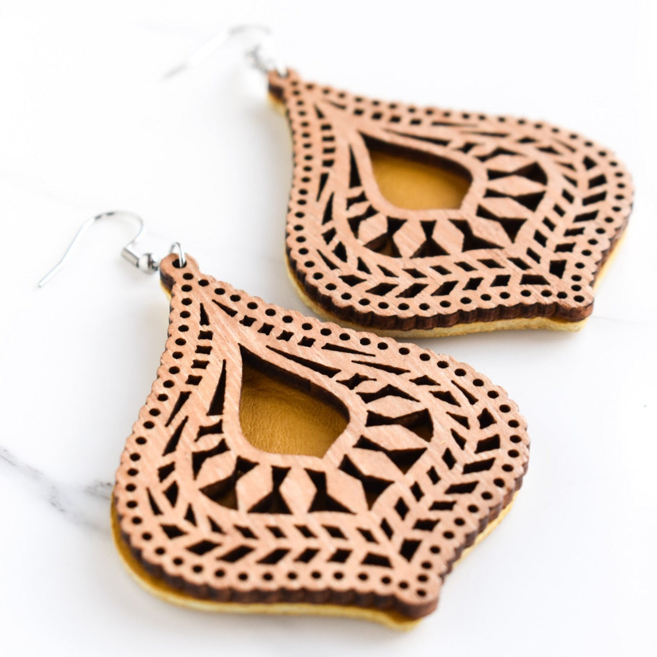 Handmade, light weight and comfortable to wear all day long leather earrings. All our earring hooks are made with a high quality stainless steel and they are hypo allergenic. They will not tarnish or irritate your sensitive skin.