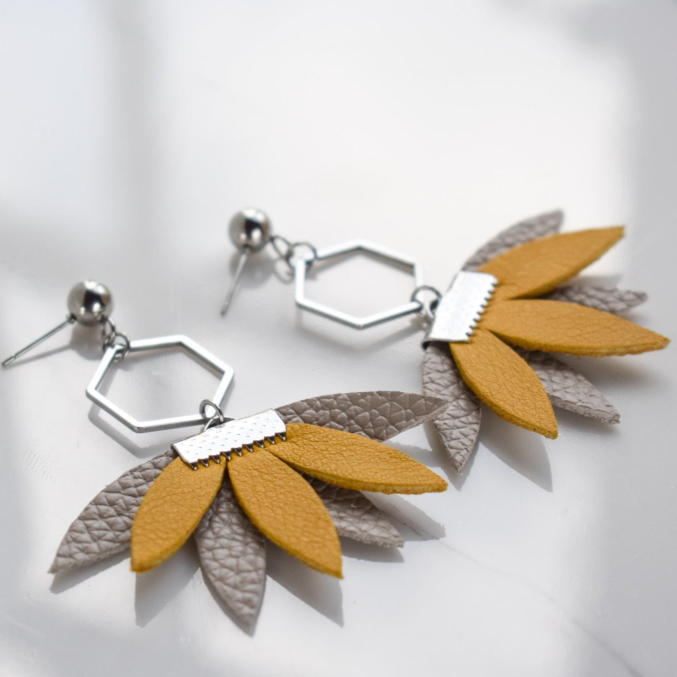 Handmade, light weight and comfortable to wear all day long leather earrings. All our earring hooks are made with a high quality stainless steel and they are hypo allergenic. They will not tarnish or irritate your sensitive skin.
