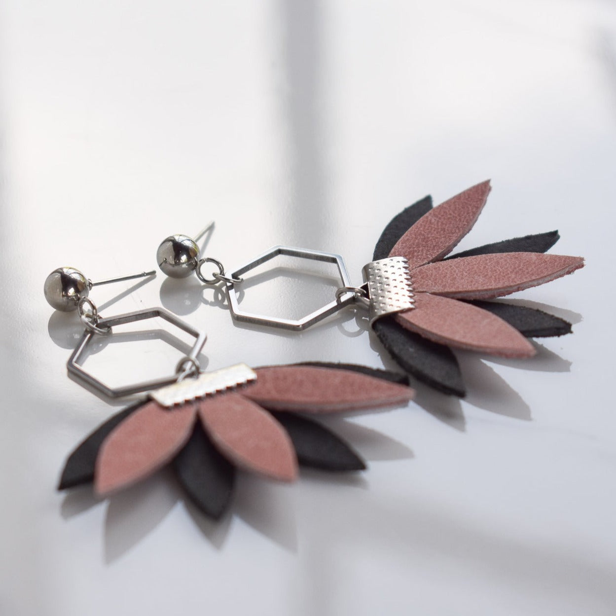 Handmade, light weight and comfortable to wear all day long leather earrings. All our earring hooks are made with a high quality stainless steel and they are hypo allergenic. They will not tarnish or irritate your sensitive skin.