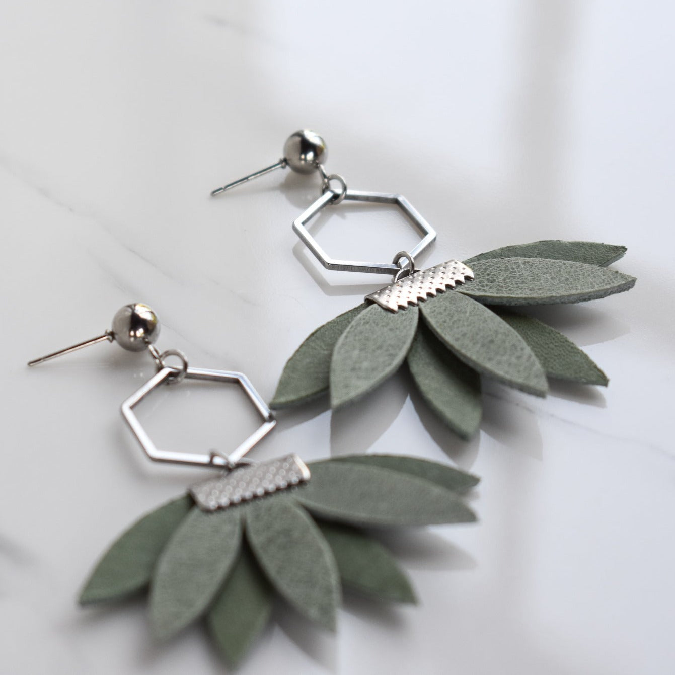 Handmade, light weight and comfortable to wear all day long leather earrings. All our earring hooks are made with a high quality stainless steel and they are hypo allergenic. They will not tarnish or irritate your sensitive skin.