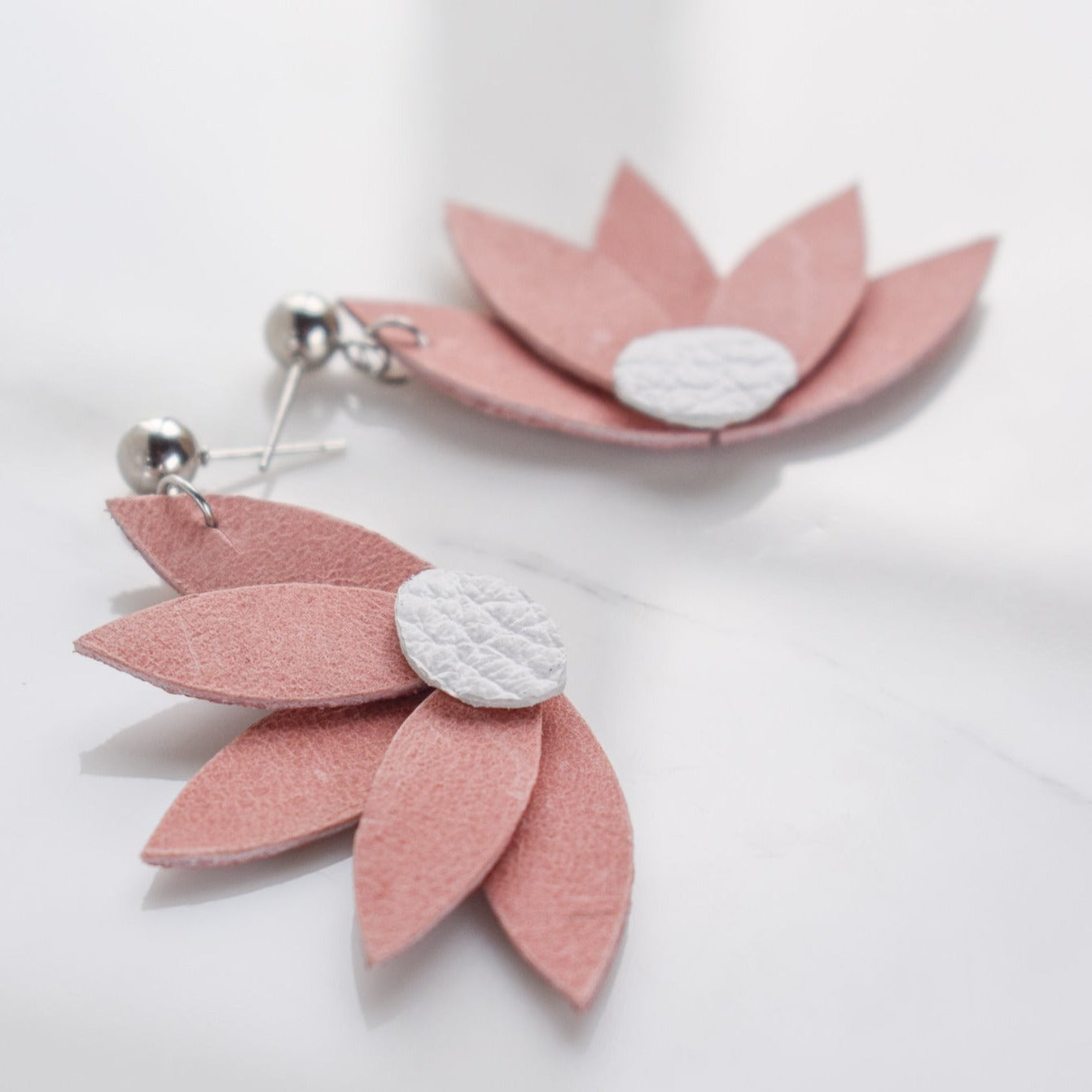 Handmade, light weight and comfortable to wear all day long leather earrings. All our earring hooks are made with a high quality stainless steel and they are hypo allergenic. They will not tarnish or irritate your sensitive skin.