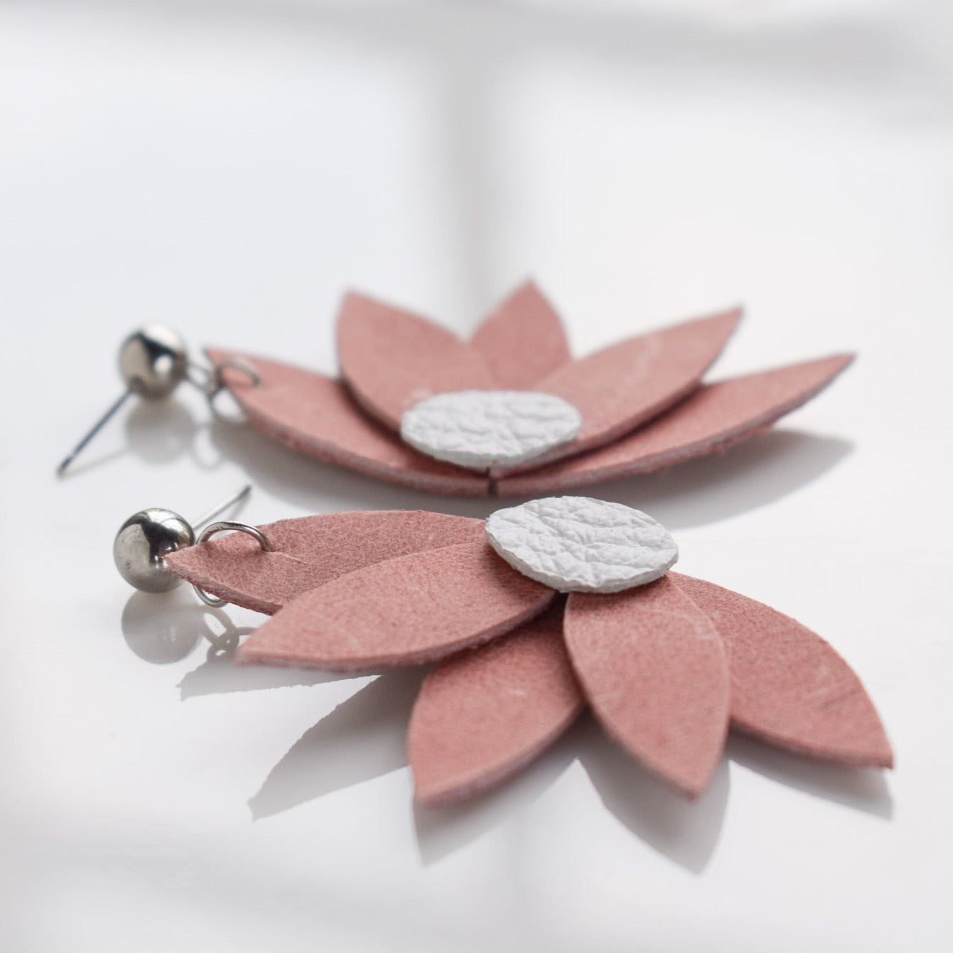 Handmade, light weight and comfortable to wear all day long leather earrings. All our earring hooks are made with a high quality stainless steel and they are hypo allergenic. They will not tarnish or irritate your sensitive skin.
